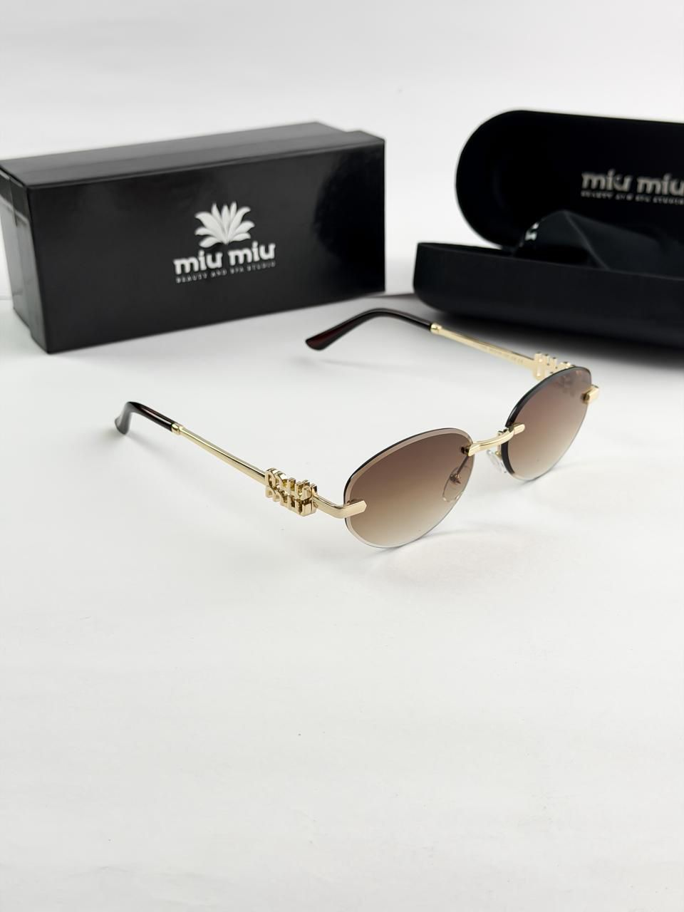 MIU MIU GOLD BROWN